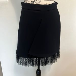 Maje black skirt in size 38 but it runs small as size 4us